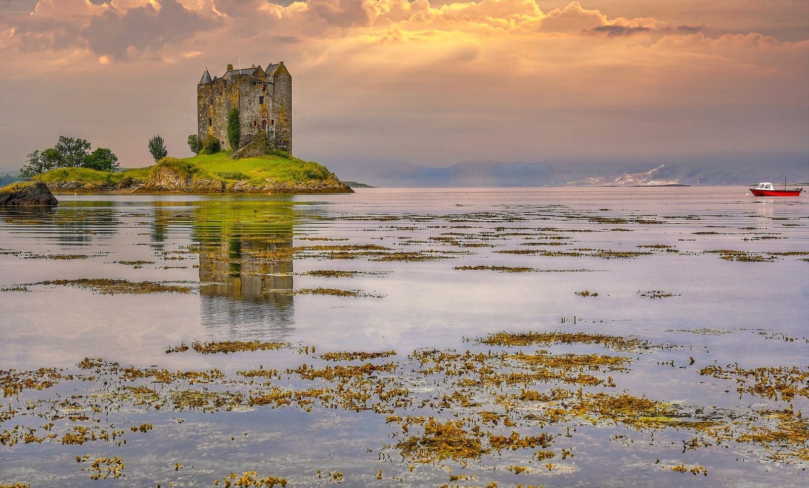 Castle Stalker on Loch Laich at sunset